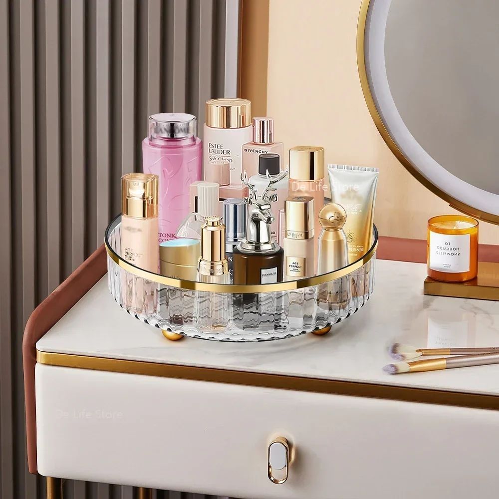 image Cosmetic products on a vanity with a round mirror and drawer.