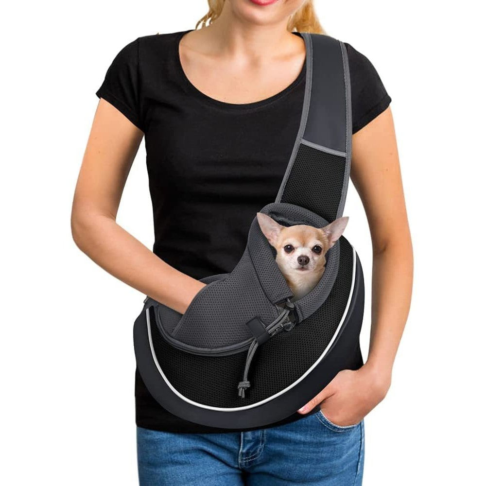 image Woman wearing a portable pet carrier bag for women with a small dog inside, highlighting comfort and style.