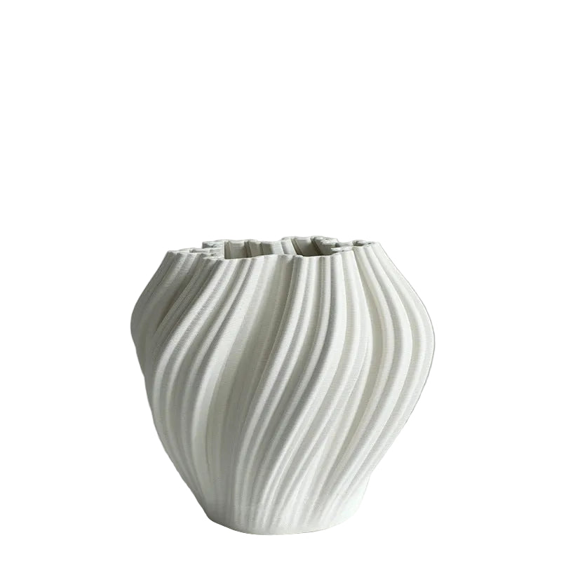 image White textured vase on a light gray surface with a light gray background