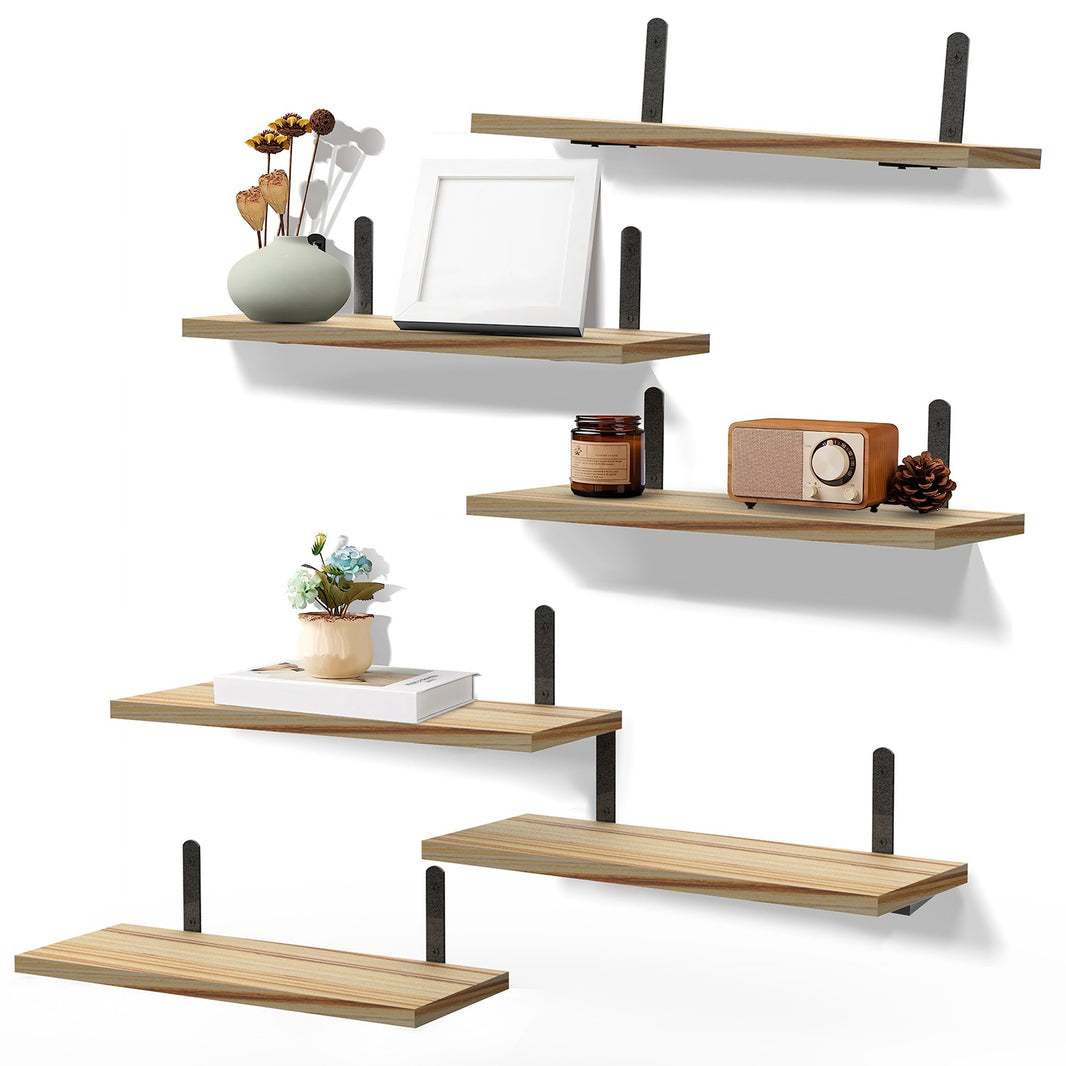 image Floating Wall Shelves displaying decorative items, plants, and photos for modern home decor and storage solutions.