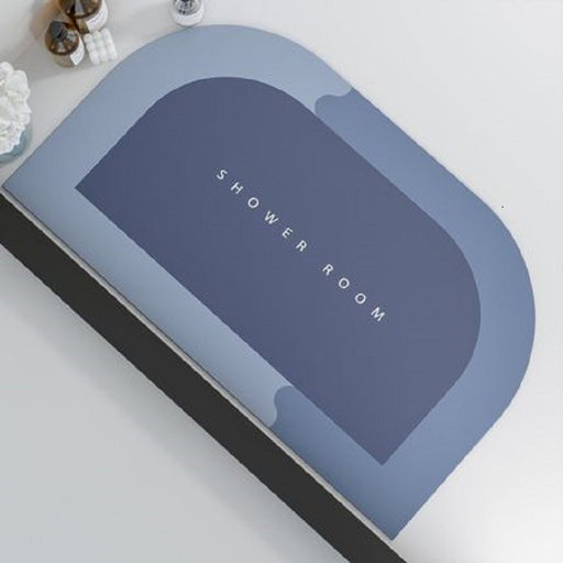 Blue mat with 'SHOWER ROOM' text on a white surface