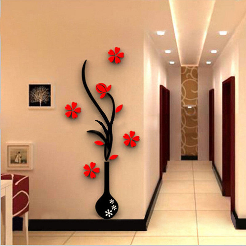 Decorative wall sticker of a vase with red flowers in a hallway.