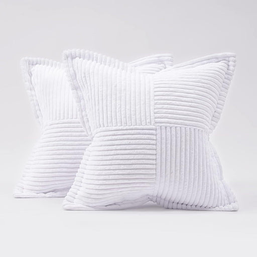 Two white textured pillows on a light gray background