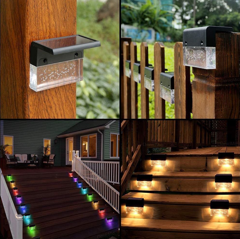 Solar-powered outdoor lights on wooden posts, railings, and steps with a blurred background.