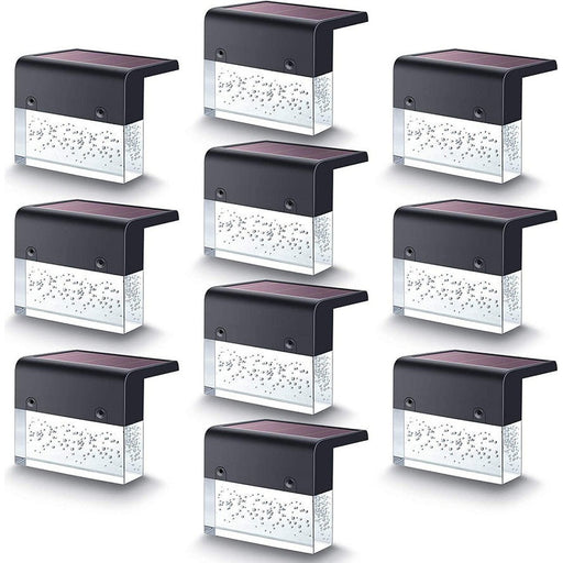 Grid of solar-powered outdoor lights on a white background