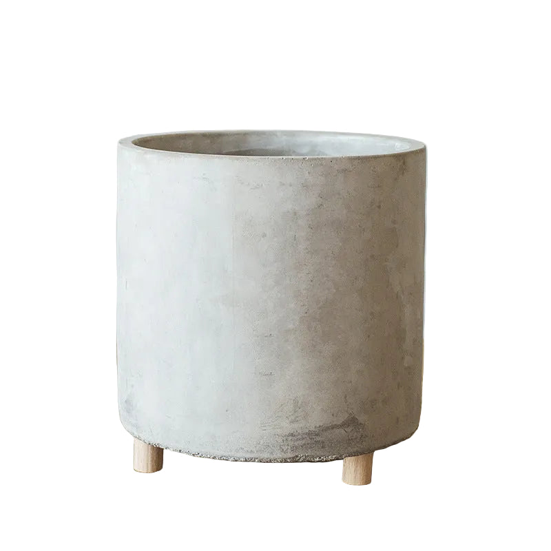 Concrete planter with dimensions on a wooden surface