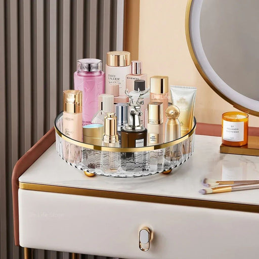 Cosmetic products on a vanity with a round mirror and drawer.