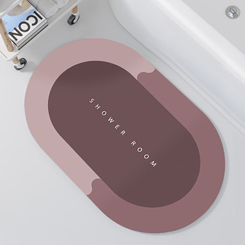 Oval-shaped mat with 'SHOWER ROOM' text on a white surface