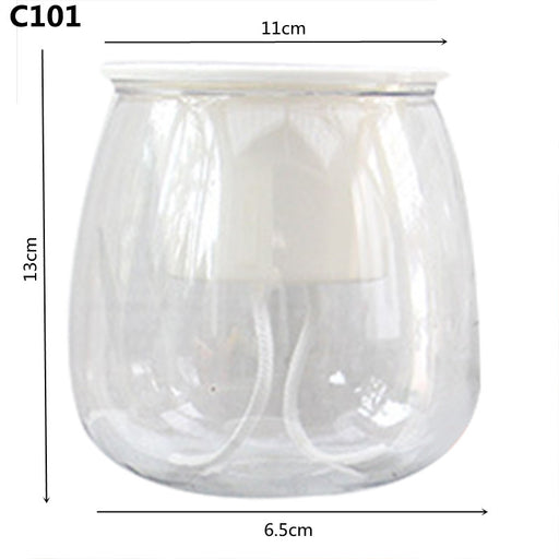Clear glass candle holder with dimensions on a white background