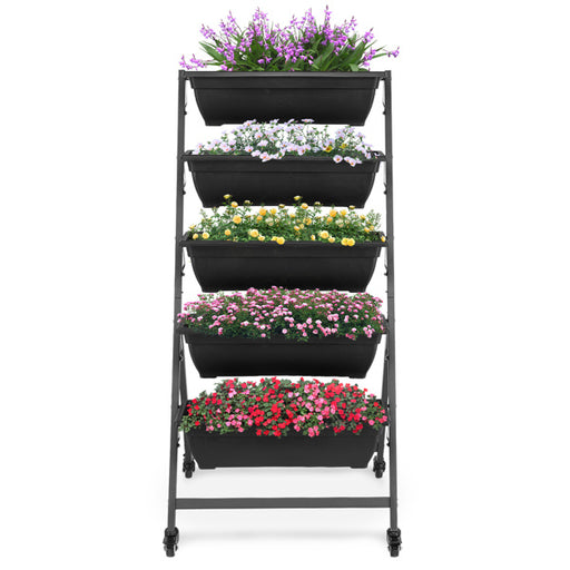 Black metal plant stand with five black planters filled with flowers on a white background