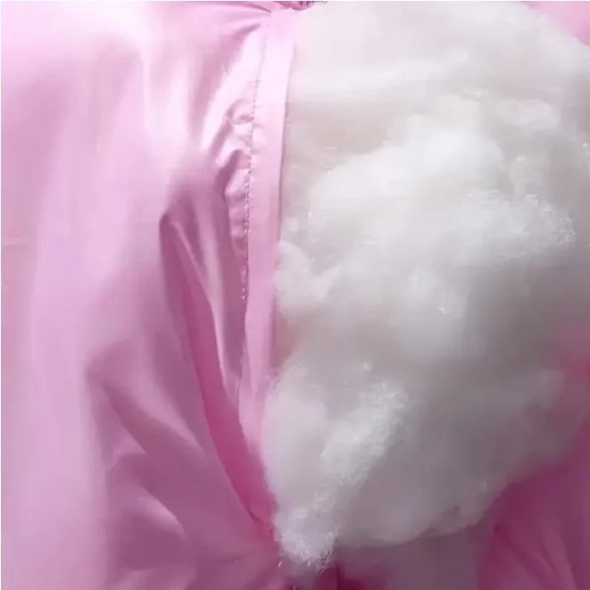 image Close-up of pink fabric with white fluffy material inside