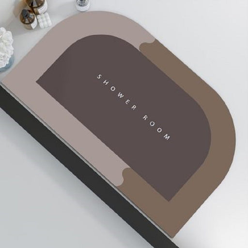 Brown bath mat with 'SHOWER ROOM' text on a white surface
