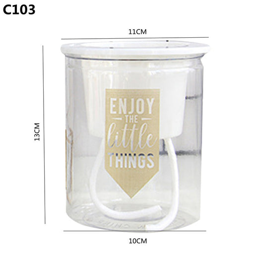 Clear glass jar with a motivational quote on a white background