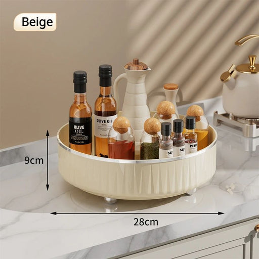 Beige round tray with various bottles on a marble countertop, showing dimensions.