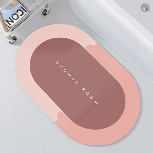 Oval bath mat with 'SHOWER ROOM' text on a bathtub