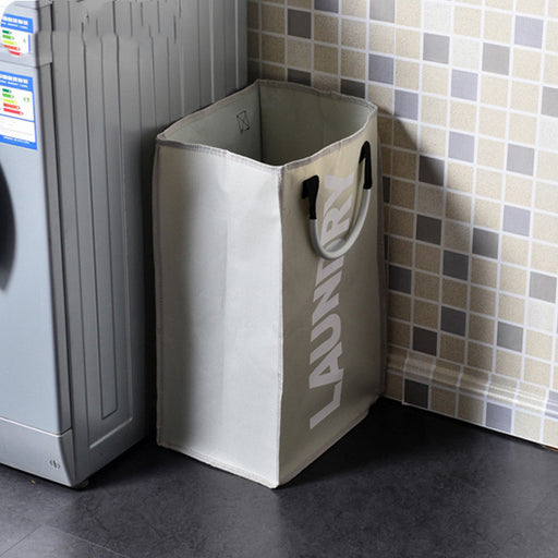 Laundry basket next to a washing machine in a tiled room